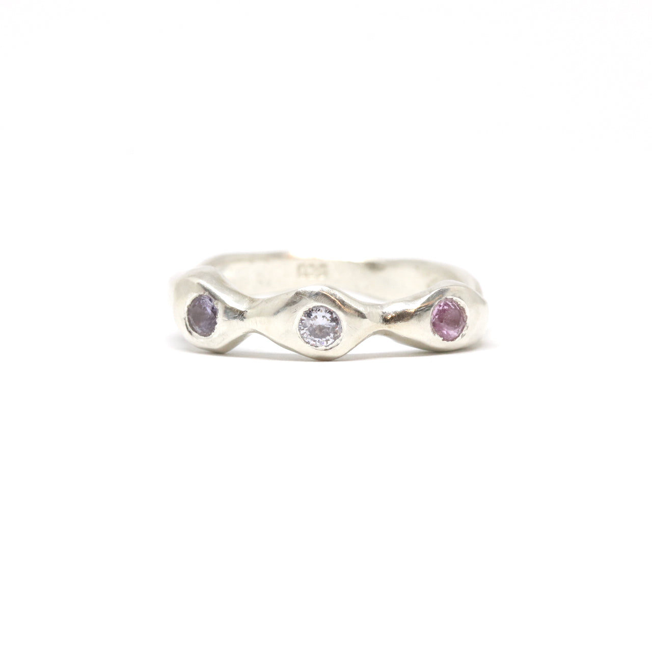 A silver ring with colourful gems. This ring was hand made in Wānaka, New Zealand by designer and jeweller Briar Hardy-Hesson.