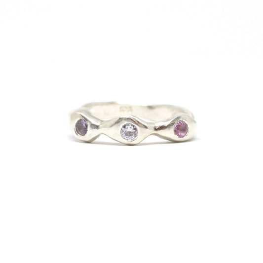 A silver ring with colourful gems. This ring was hand made in Wānaka, New Zealand by designer and jeweller Briar Hardy-Hesson.