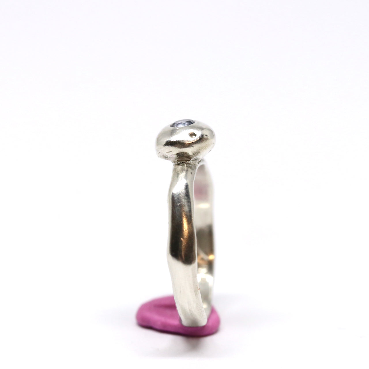 A silver ring with colourful gems. This ring was hand made in Wānaka, New Zealand by designer and jeweller Briar Hardy-Hesson.