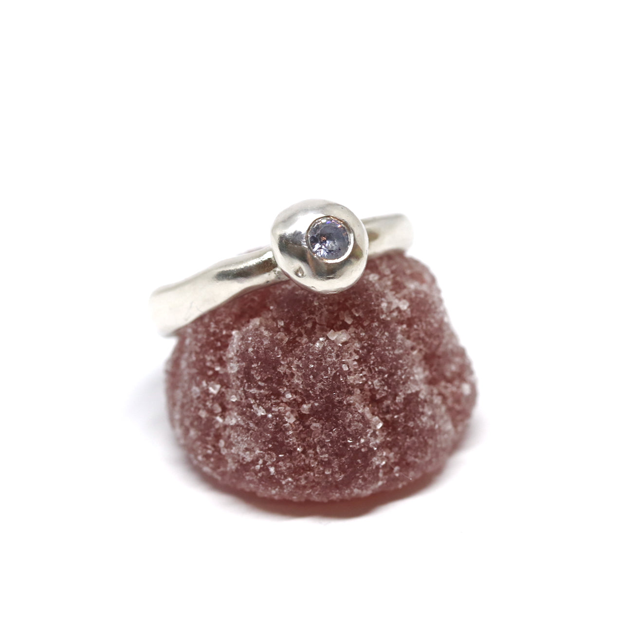 A silver ring with colourful gems. This ring was hand made in Wānaka, New Zealand by designer and jeweller Briar Hardy-Hesson.