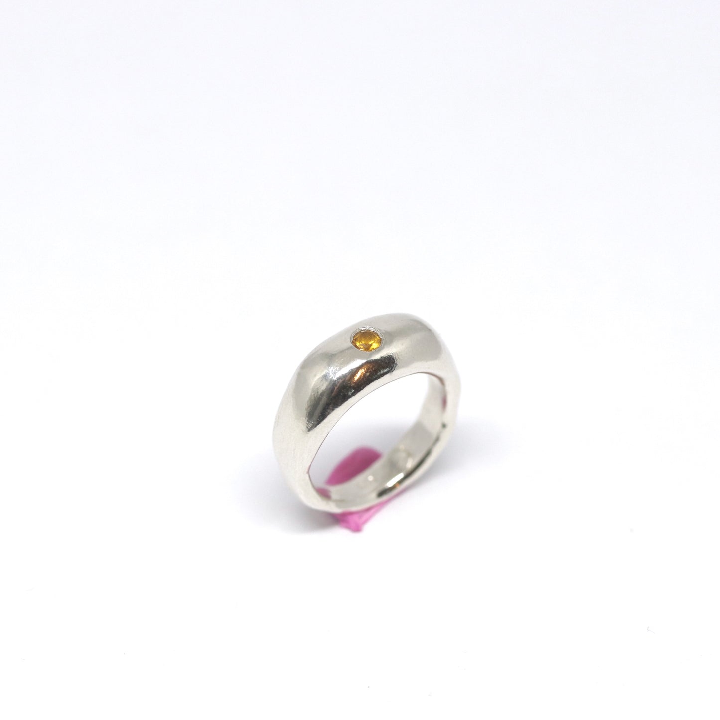 A curvy and chunky sterling silver ring with one citrine gem.