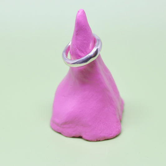 A crescent moon shaped sterling silver ring.