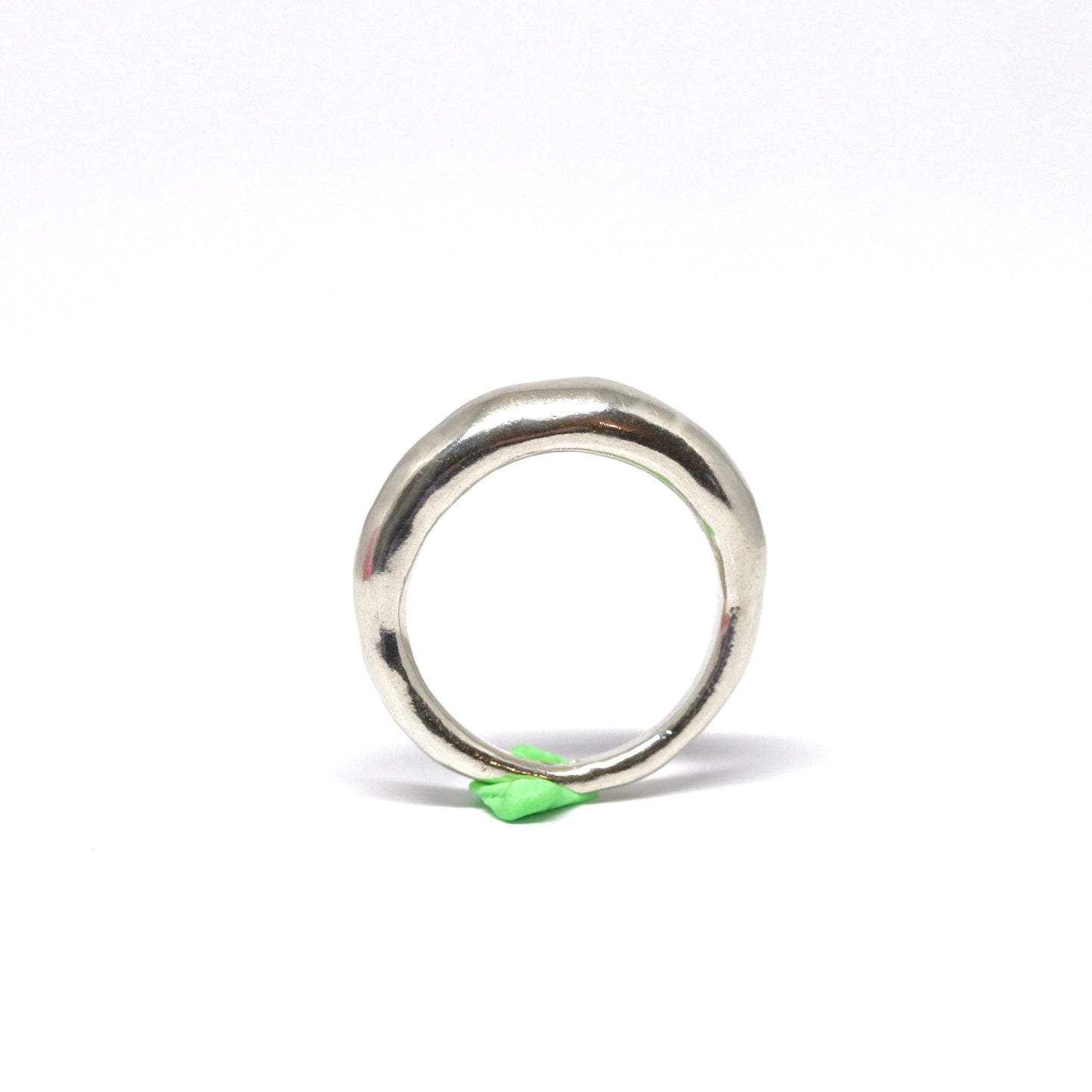 A crescent moon shaped sterling silver ring.