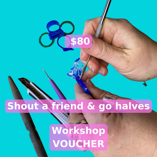 Hand holding a small blue object with text overlay on a teal background