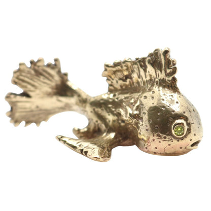 Gold fish sculpture on a white background