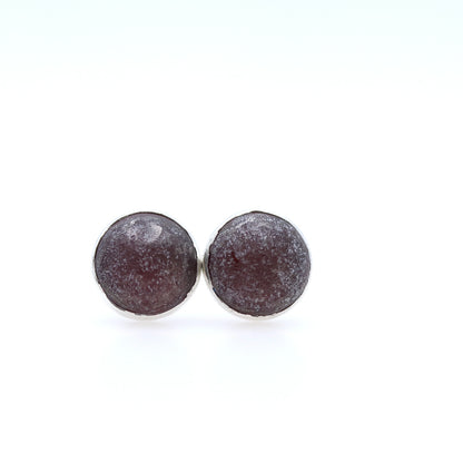 Round brown earrings on a white background