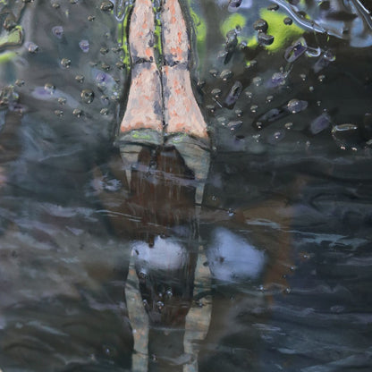Close up detail of painting of woman diving below water with legs in the air