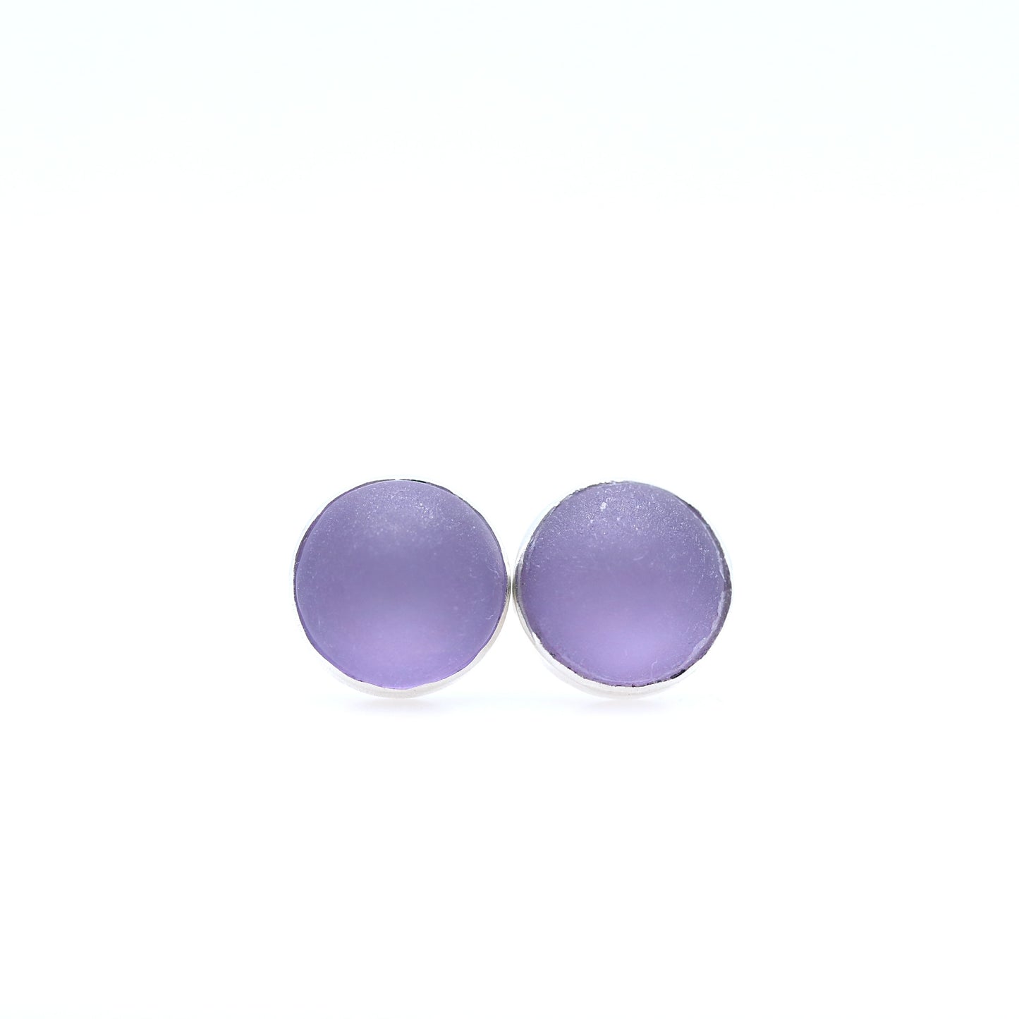 Purple earrings on a white background
