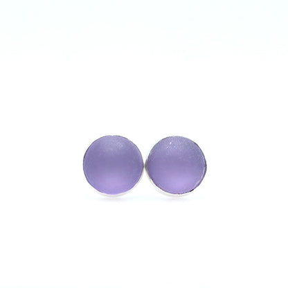 Purple earrings on a white background