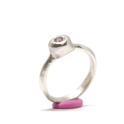 A silver ring with colourful gems. This ring was hand made in Wānaka, New Zealand by designer and jeweller Briar Hardy-Hesson.