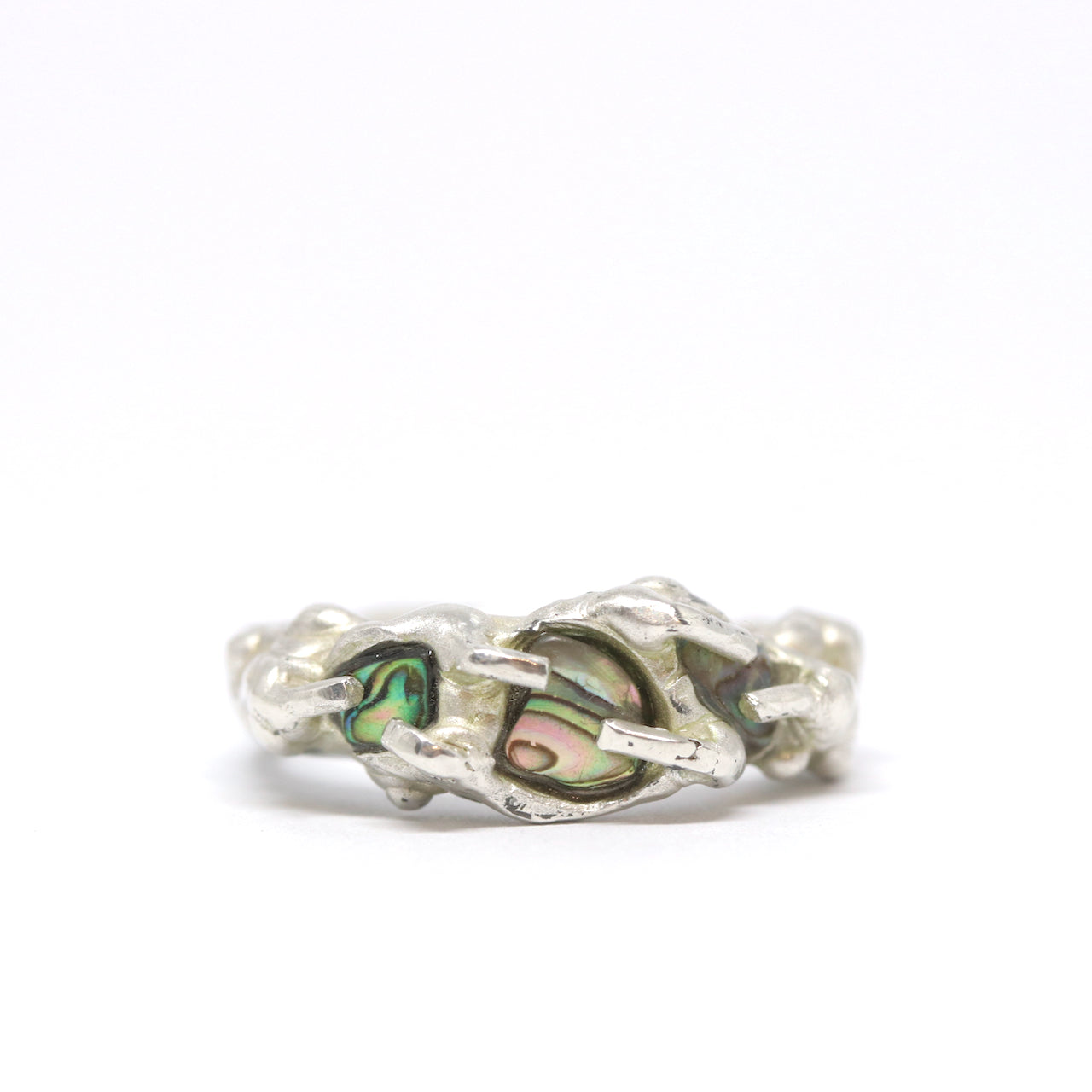 A sterling silver and paua shell ring. This ring was hand made in Wānaka, New Zealand by designer and jeweller Briar Hardy-Hesson.
