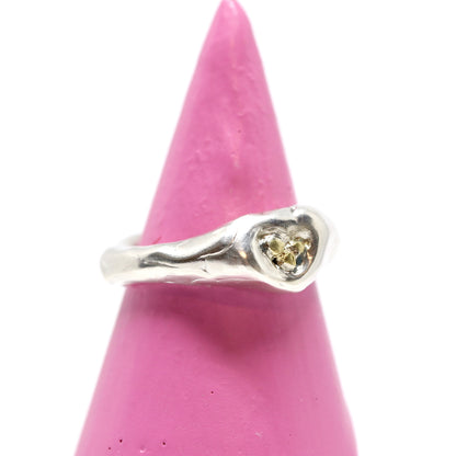 A sterling silver ring with 24k gold. This ring was hand made in Wānaka, New Zealand by designer and jeweller Briar Hardy-Hesson.