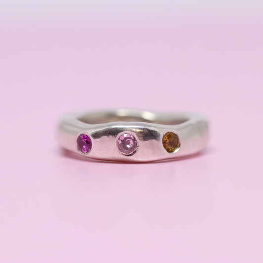 A sterling silver ring, just a tad chunky with citrine, pink and ruby pink cubic zirconia.