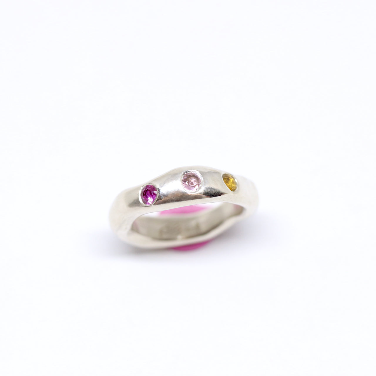 A sterling silver ring, just a tad chunky with citrine, pink and ruby pink cubic zirconia.