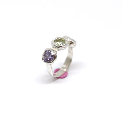 Three heart shaped cubic zirconia in lavender and light green. Encased in melty sterling silver. Hand made in Wānaka, New Zealand by designer and jeweller Briar Hardy-Hesson.