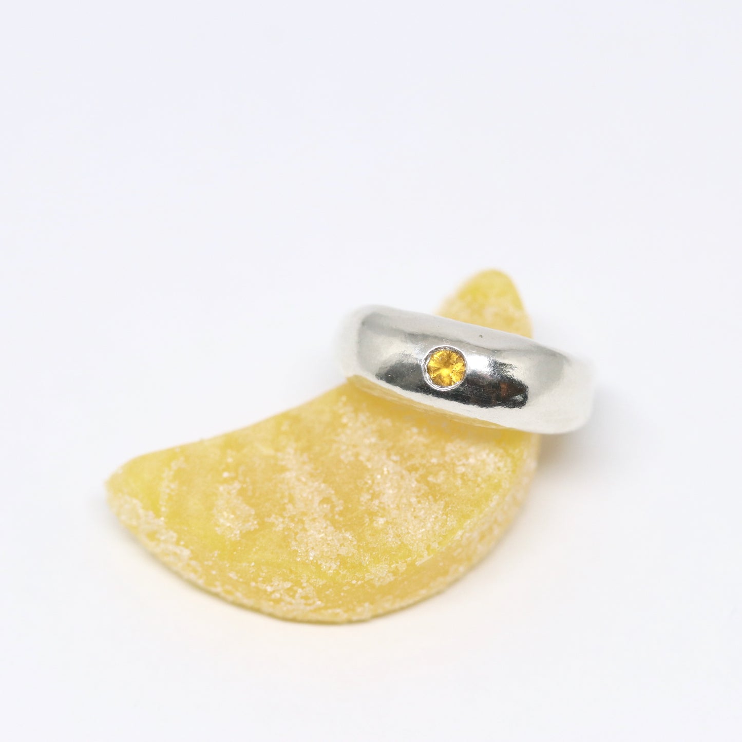 A curvy and chunky sterling silver ring with one citrine gem.
