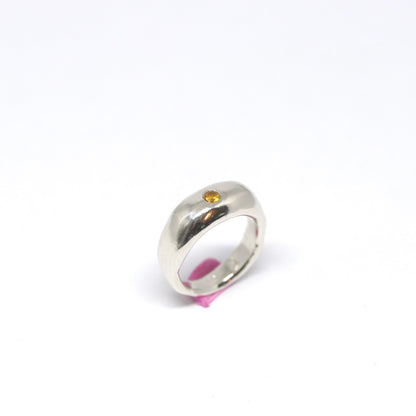 A curvy and chunky sterling silver ring with one citrine gem.