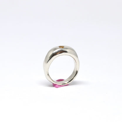 A curvy and chunky sterling silver ring with one citrine gem.