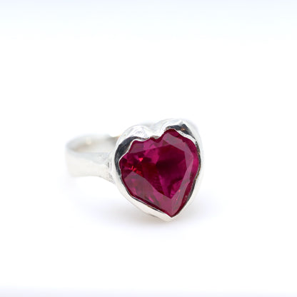 Silver ring with a pink heart-shaped gemstone on a white background. New Zealand made jewellery designer