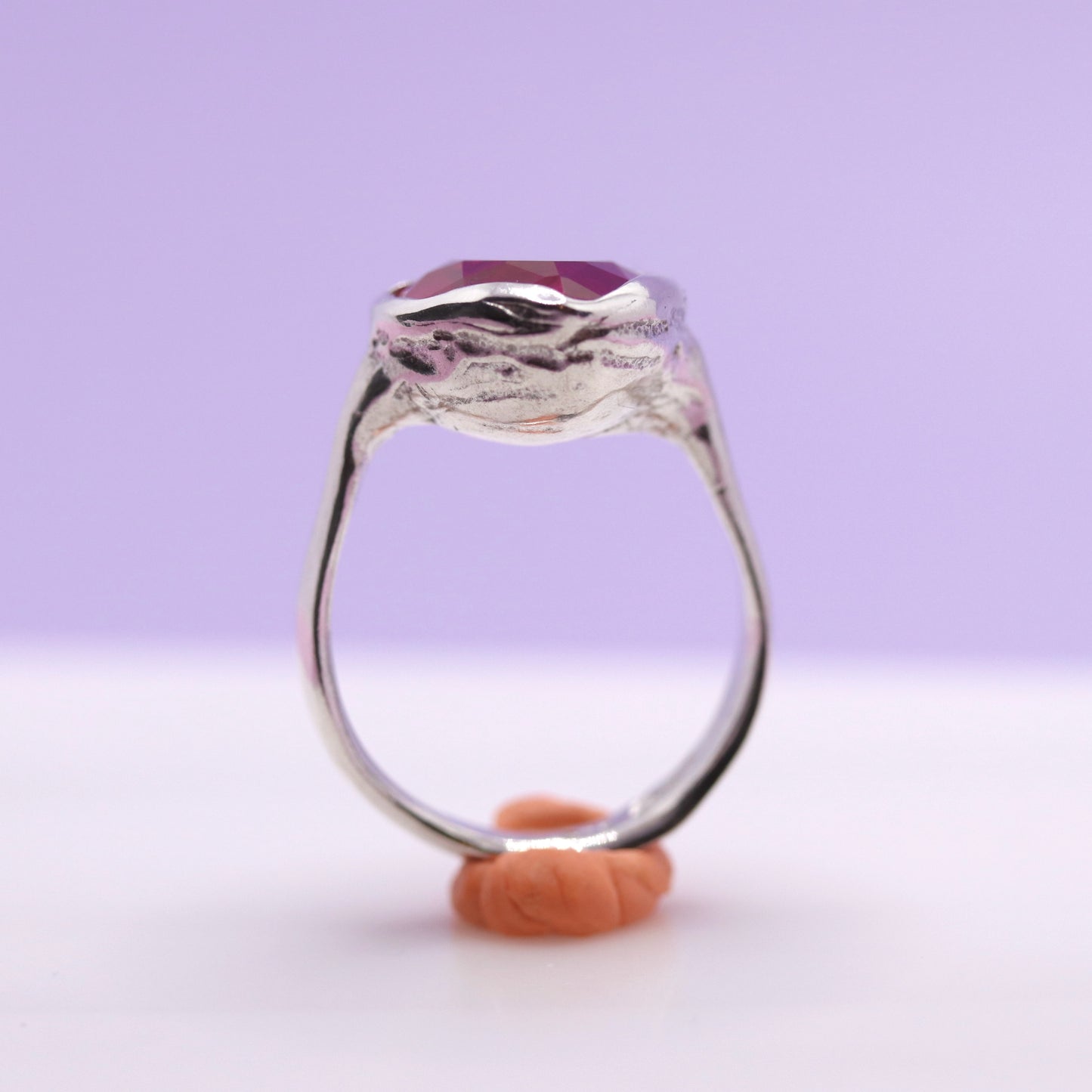 Silver ring with a pink heart gemstone on a white background. New Zealand made jewellery designer