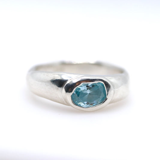 Silver ring with a blue gemstone on a white background. New Zealand made jewellery designer