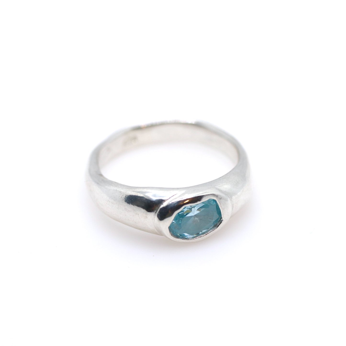 Silver ring with a aquamarine gemstone on a white background.New Zealand made jewellery designer