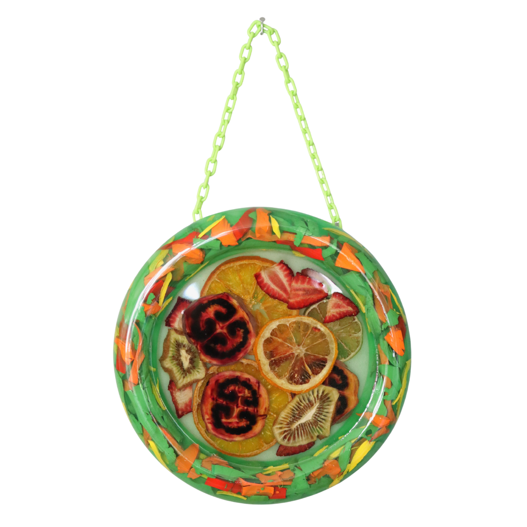 Decorative hanging resin artwork with fruit  on a white background