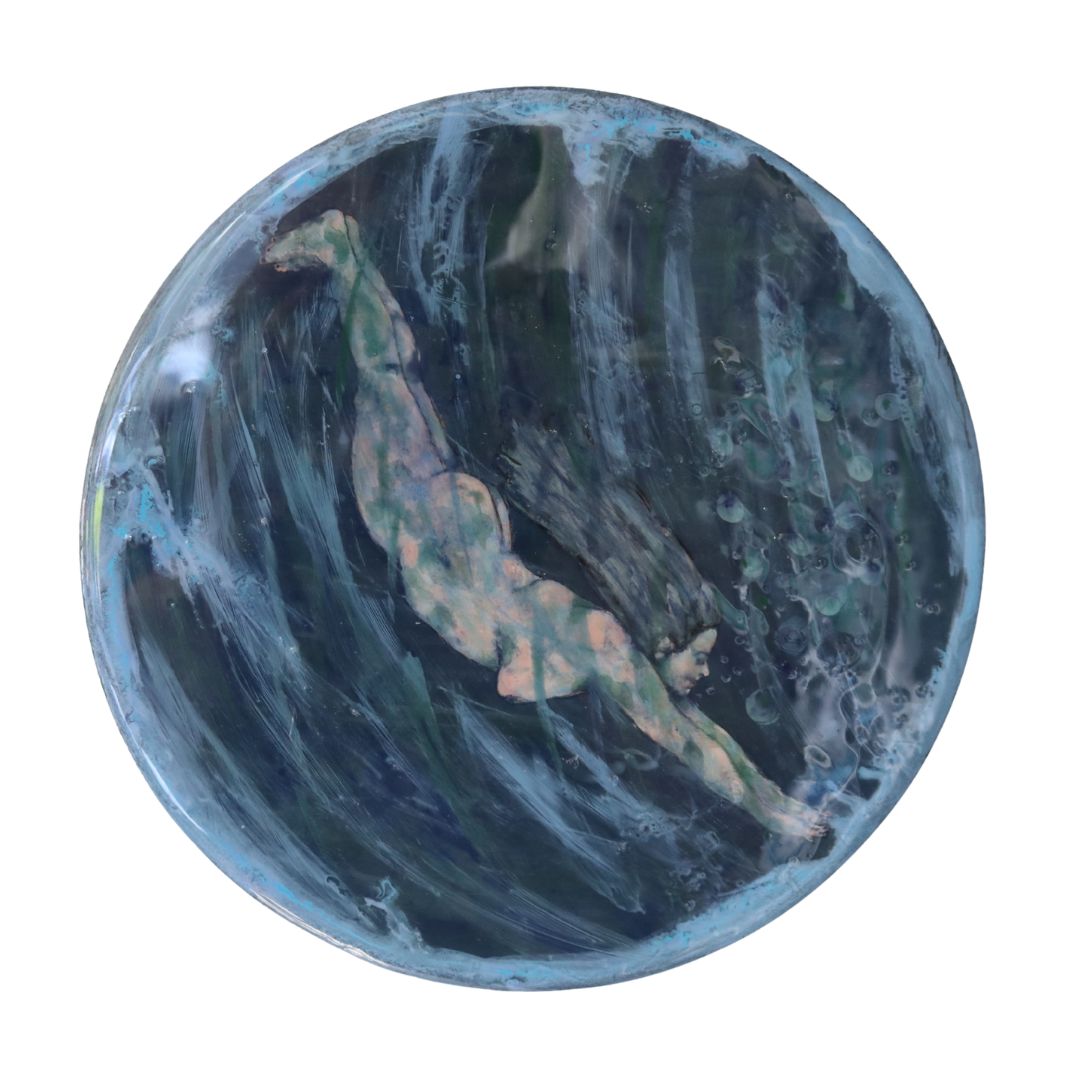 Round painting of woman diving underwater