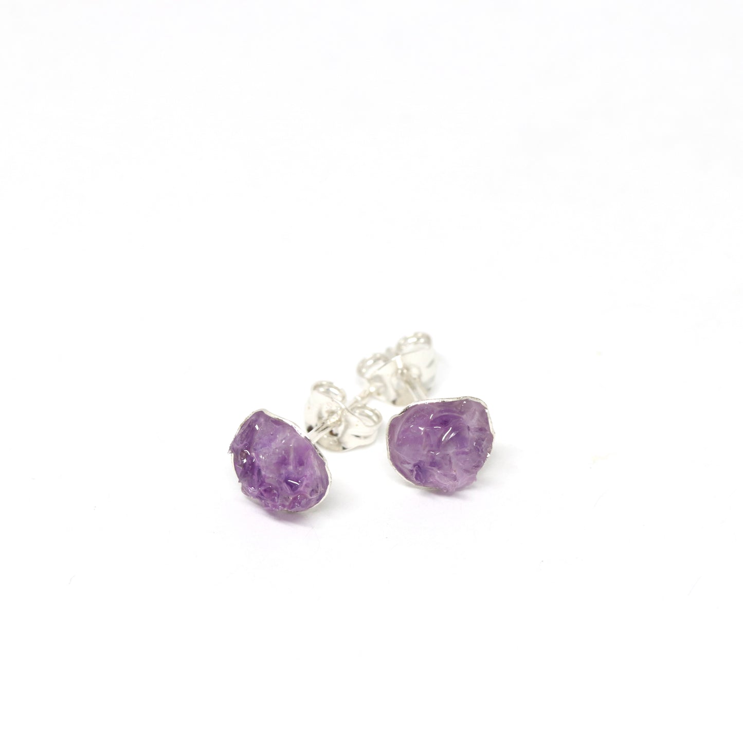 Amethyst . Gemstone and silver stud earrings. Made in Wanaka. Unique, colourful jewellery designed and crafted by New Zealand artist and jeweller Briar Hardy-Hesson.