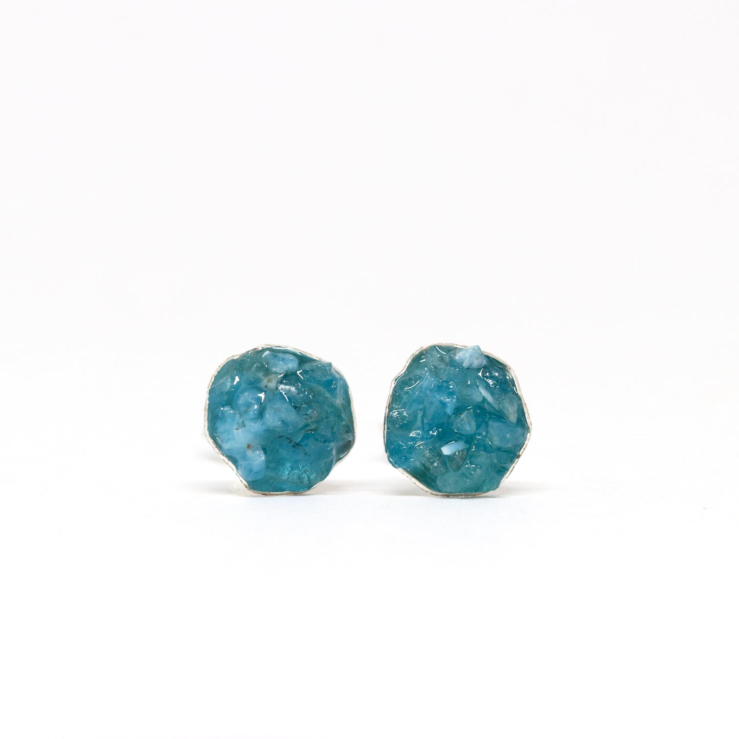 Apatite (dark). Gemstone and silver stud earrings. Made in Wanaka. Unique, colourful jewellery designed and crafted by New Zealand artist and jeweller Briar Hardy-Hesson.